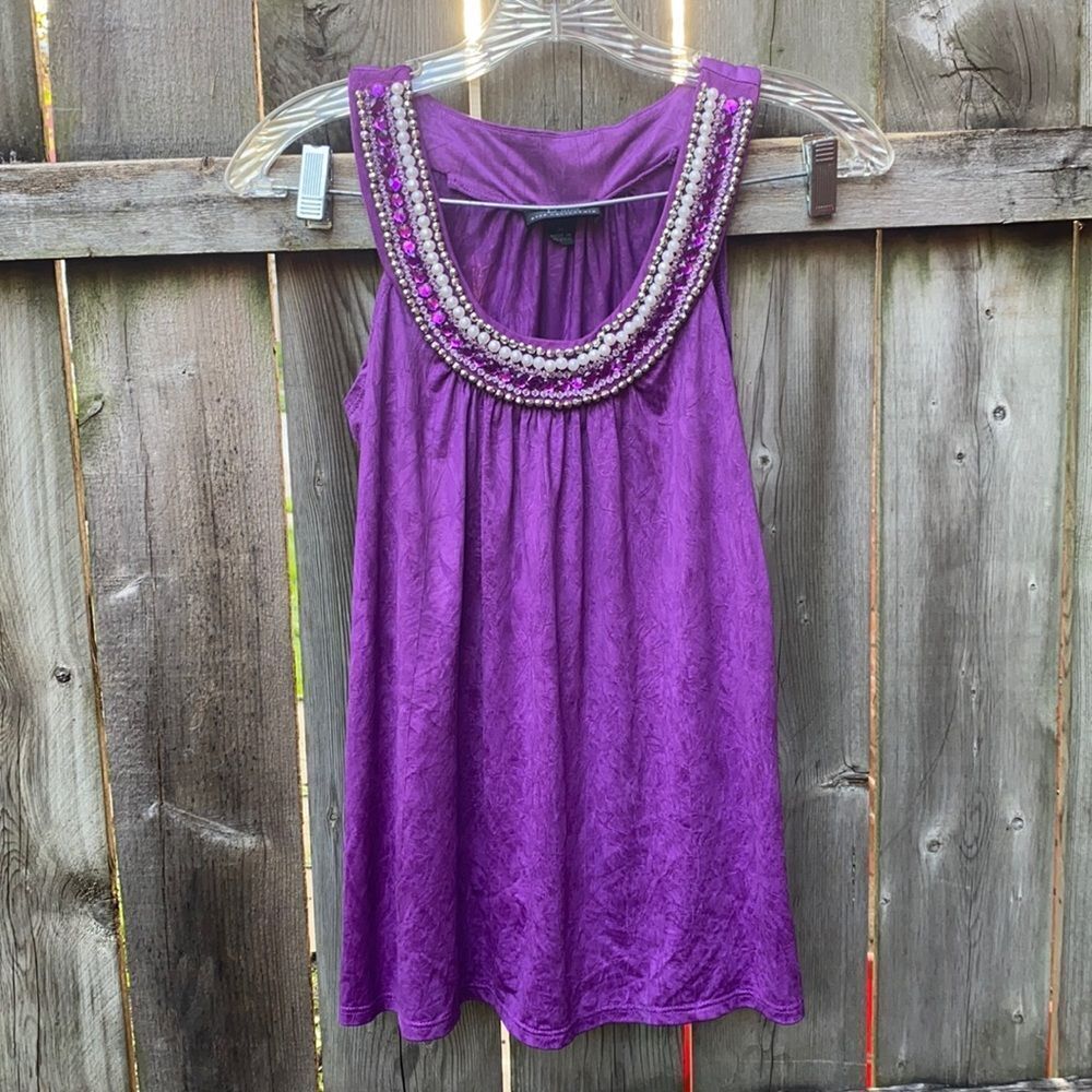 B. Wear bedazzled purple top sz. M